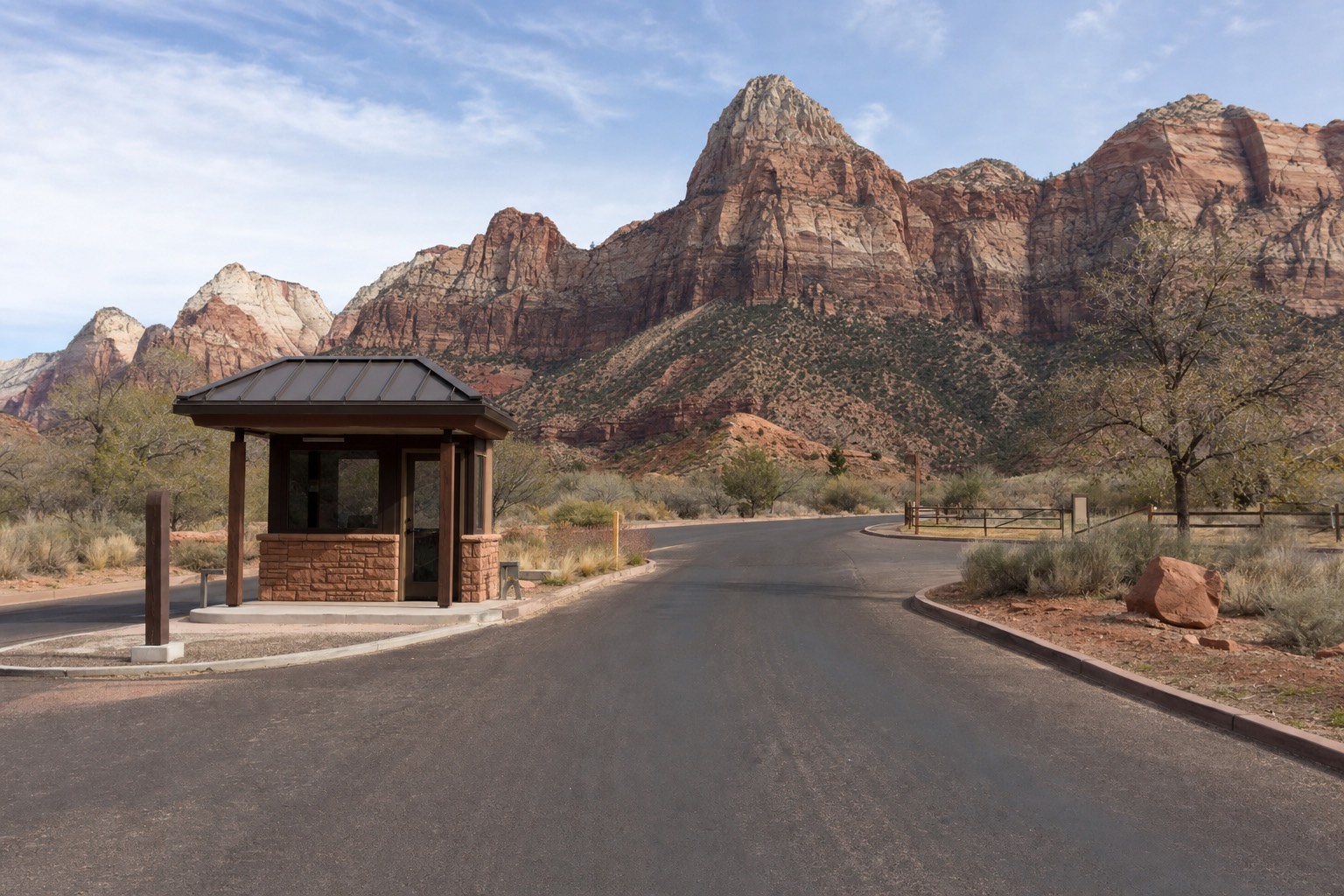 The paved entrance road toward Red Rock Canyon's red sandstone cliffs