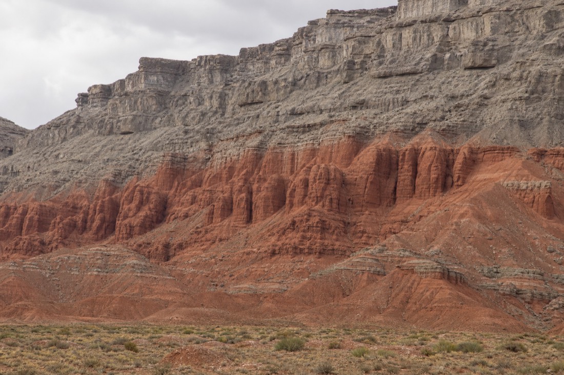 The grey limestone caprock of the Keystone Thrust above the red sandstone
