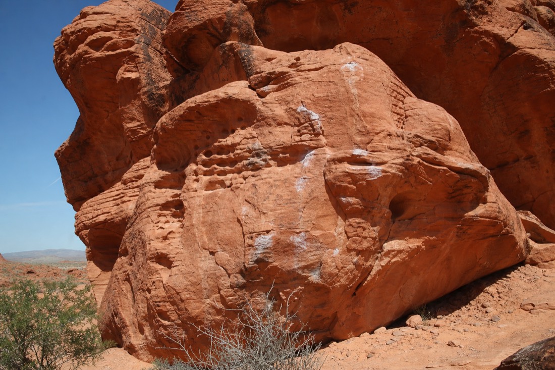 A climber working a boulder problem at Kraft Boulders